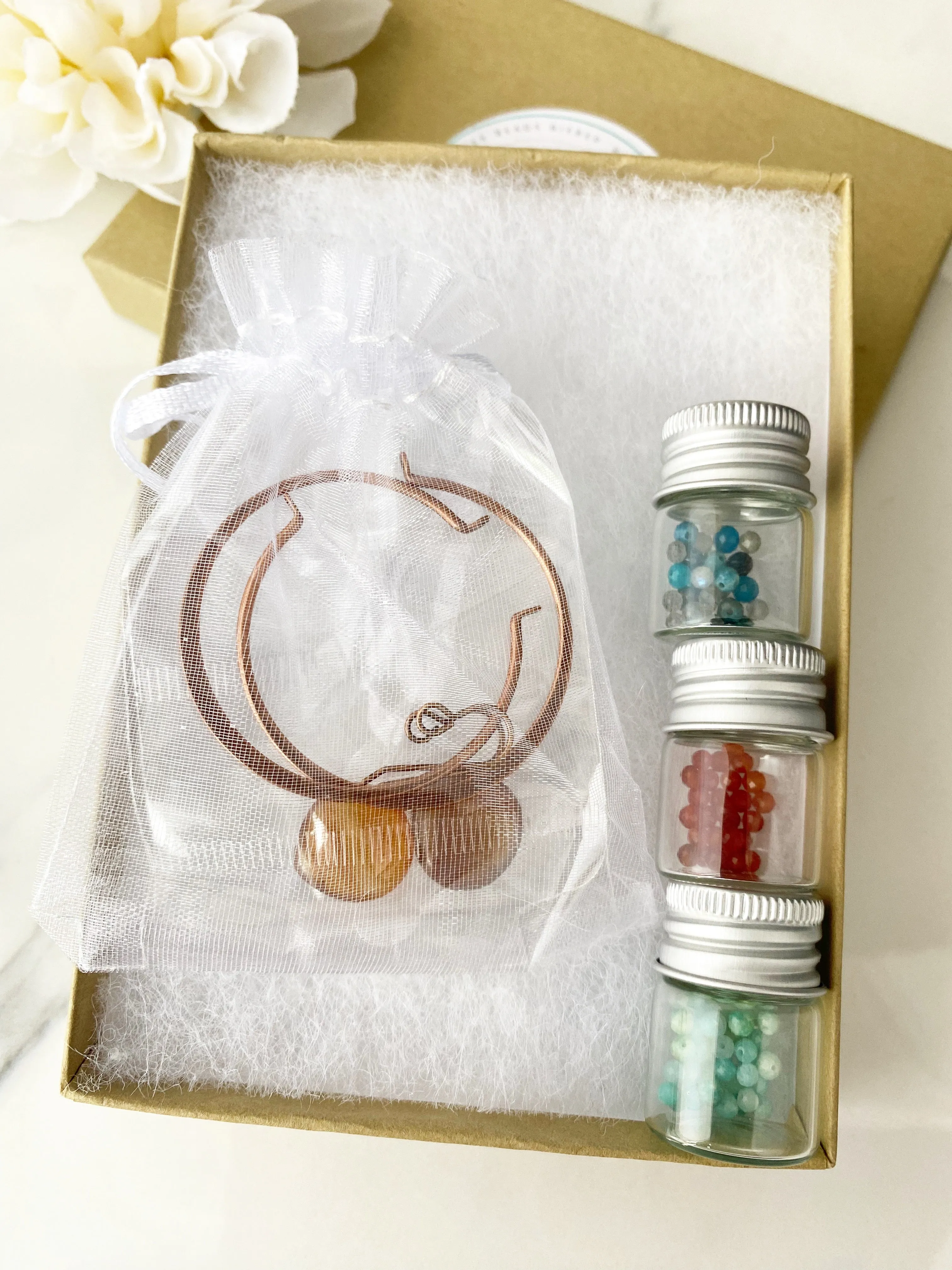 Bead kit. Copper earrings, wire wrapped hoops, mixed stone and carnelian agate drops. Belle Magazine 2022.
